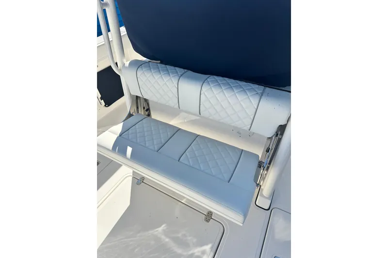 Slide: The Image of 2024 Pursuit S 288 Sport boat with white quilted seating detail. - 6