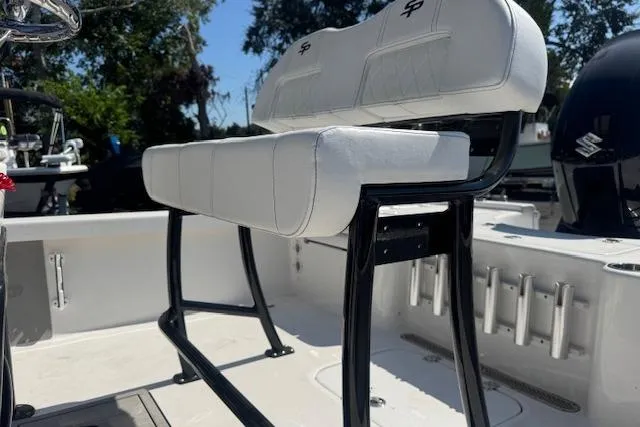 Slide: The Image of 2024 Sea Pro 210 Bay boat with white seating and black frame, showcasing modern design. - 10