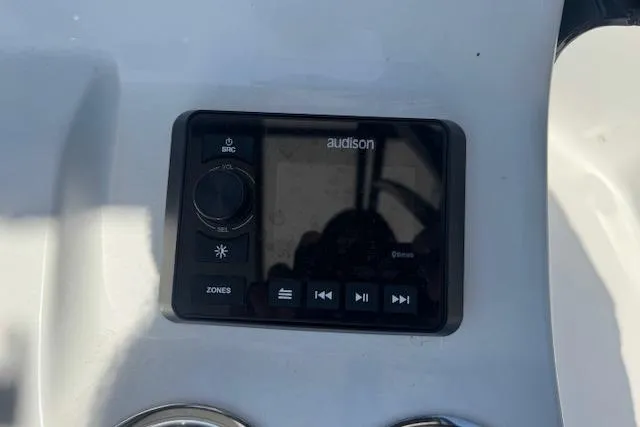 Slide: The Image of 2024 Sea Pro 210 Bay boat console featuring an Audison audio control panel. - 16