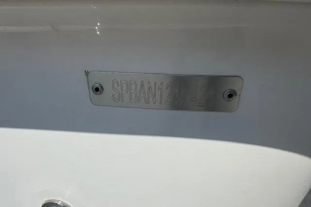 Slide: The Image of 2024 Sea Pro 210 Bay boat propeller and motor close-up on pavement. - 18