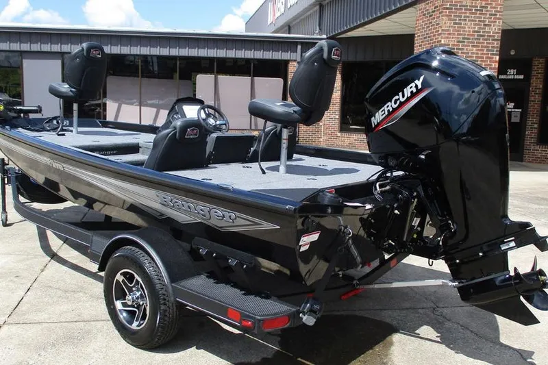 Slide: The Image of 2026 Ranger RT178 boat with Mercury engine, parked outside a building. - 10
