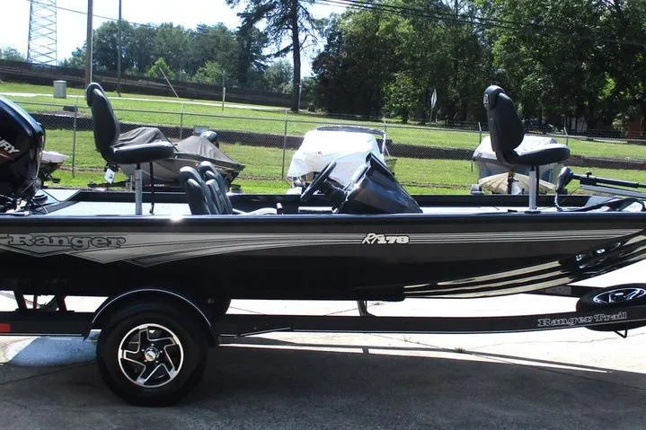 Slide: The Image of 2026 Ranger RT178 fishing boat on trailer, parked outdoors. - 3