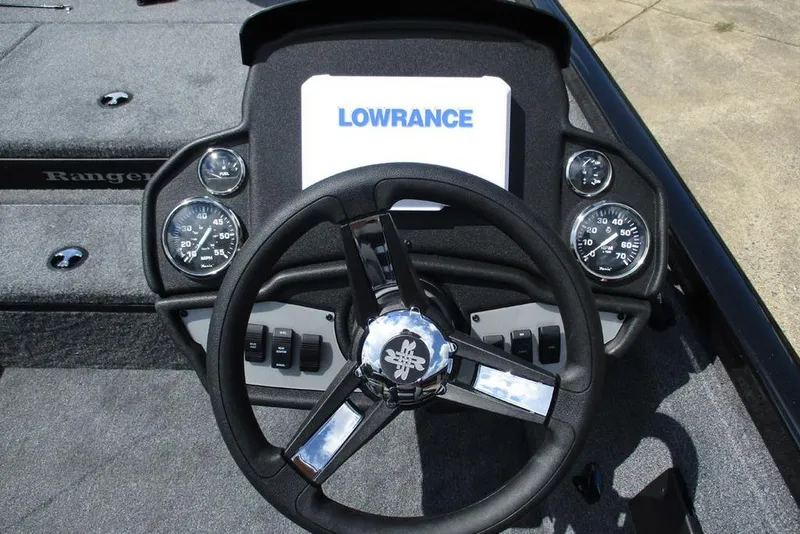 Slide: The Image of 2026 Ranger RT178 boat dashboard with steering wheel and Lowrance display. - 4