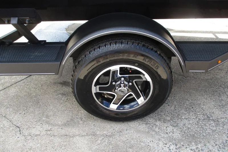 Slide: The Image of 2026 Ranger RT178 trailer wheel with black alloy rim on concrete surface. - 5