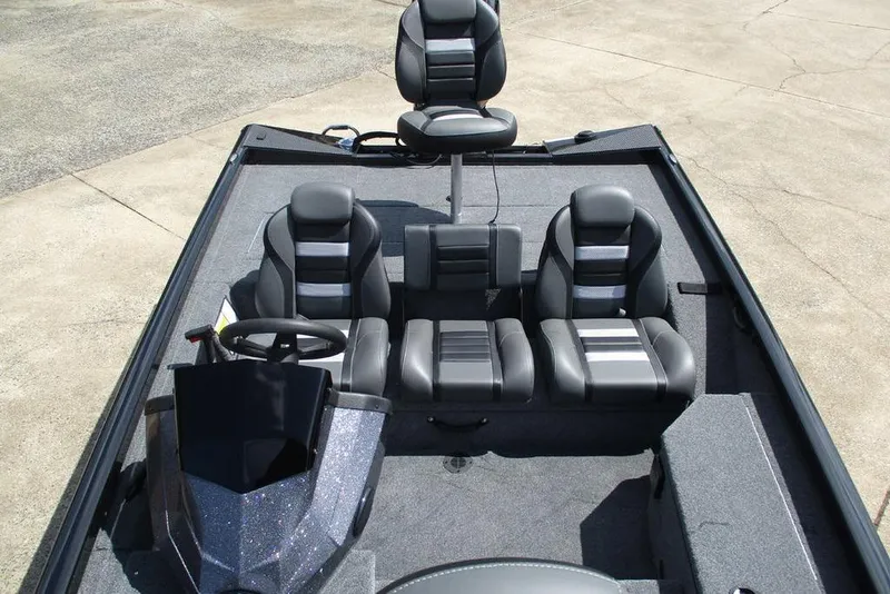 Slide: The Image of 2026 Ranger RT178 boat interior with four black and gray seats, steering wheel, and carpeted floor. - 6