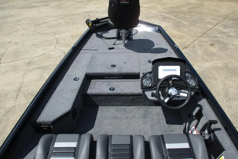 Slide: The Image of 2026 Ranger RT178 boat interior with steering wheel and Lowrance display. - 7