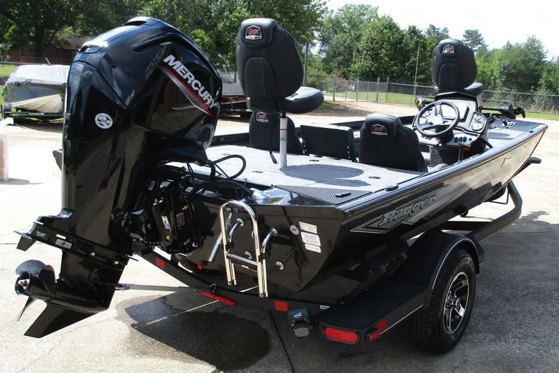 Slide: The Image of 2026 Ranger RT178 boat with Mercury engine, parked outdoors on a trailer. - 9