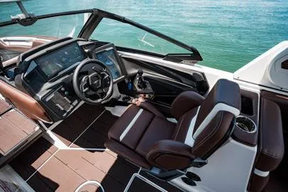 Slide: The Image of 2026 Supra SA boat interior with modern seating, advanced dashboard, and sleek design elements. - 16