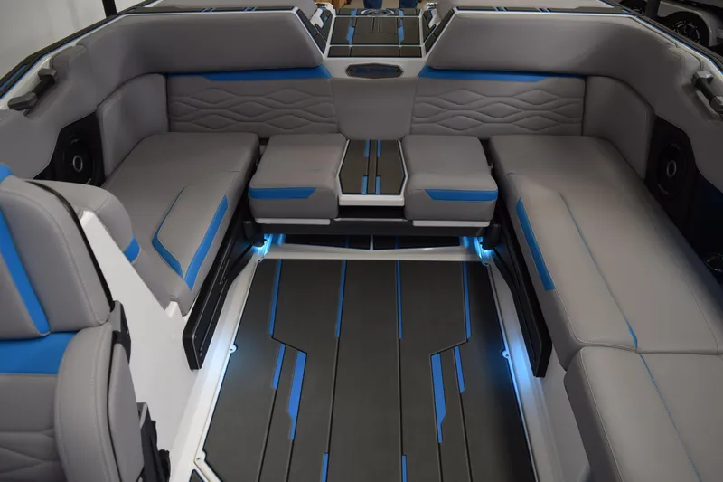 Slide: The Image of 2026 Supra SA boat interior with modern seating, blue accents, and ambient lighting. - 19