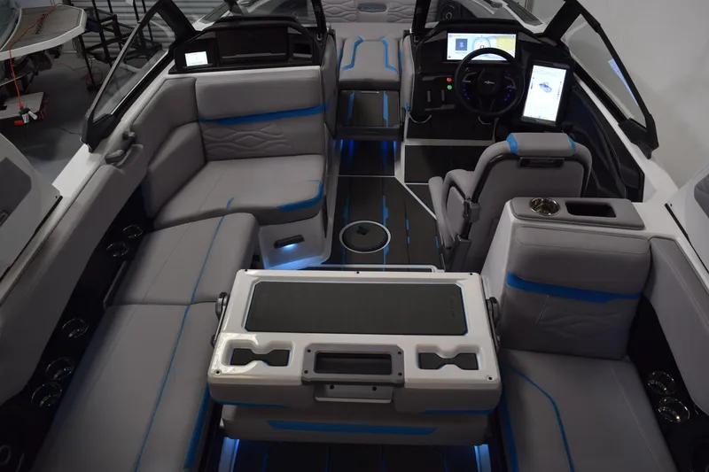 Slide: The Image of 2026 Supra SA boat interior with modern seating, digital controls, and ambient lighting. - 27