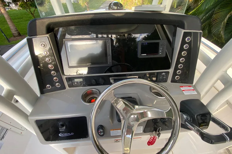 Slide: The Image of 2020 Robalo Center Console boat seat with white and gray upholstery. - 20