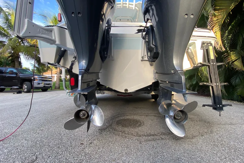 Slide: The Image of Robalo 2020 Center Console boat top view with sunlight and trees in the background. - 27