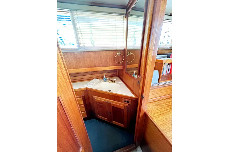 Slide: The Image of 1980 Californian 42 LRC yacht bathroom with wooden cabinetry and corner sink. - 31