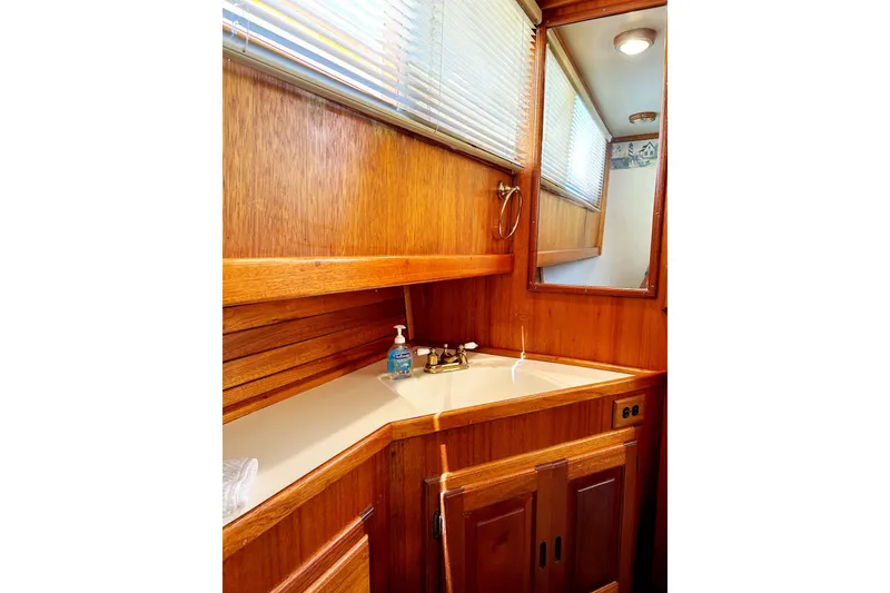 Slide: The Image of 1980 Californian 42 LRC yacht bathroom with wooden cabinetry and mirror. - 34