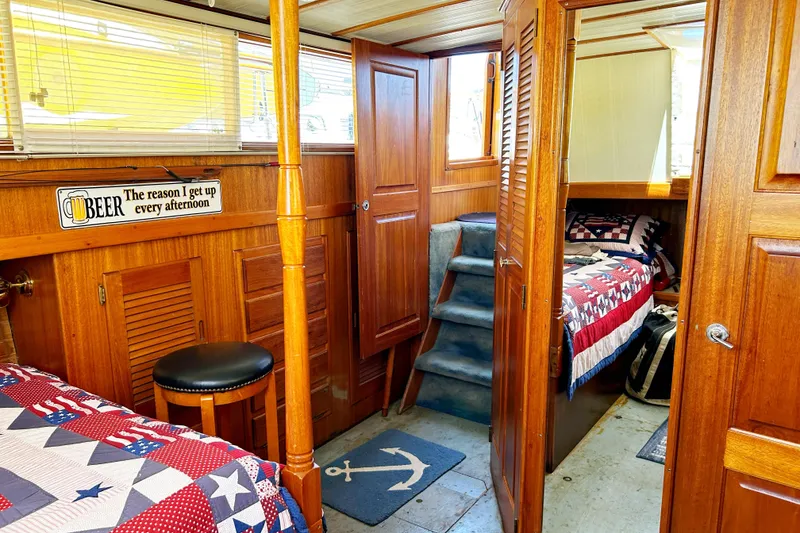 Slide: The Image of Interior of a 1980 Californian 42 LRC boat with wooden paneling and nautical decor. - 39