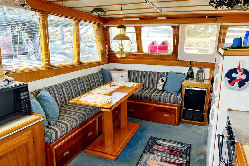 Slide: The Image of Interior of 1980 Californian 42 LRC yacht with cozy seating and nautical decor. - 40