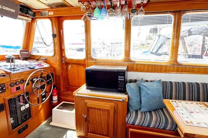 Slide: The Image of Interior of 1980 Californian 42 LRC yacht with helm, microwave, and seating area. - 45