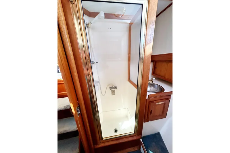 Slide: The Image of 1980 Californian 42 LRC yacht bathroom with shower and wooden cabinetry. - 53