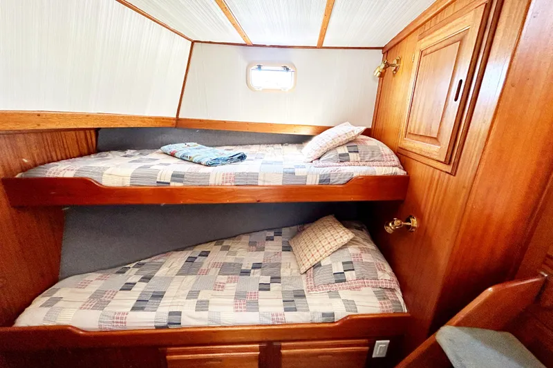 Slide: The Image of Bunk beds in 1980 Californian 42 LRC yacht cabin with wooden interior. - 55
