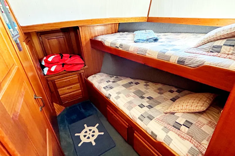Slide: The Image of Cozy cabin with bunk beds in 1980 Californian 42 LRC yacht interior. - 56