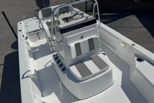 Slide: The Image of 2026 Frontier 2104 boat interior with seating and steering console, featuring modern design. - 11