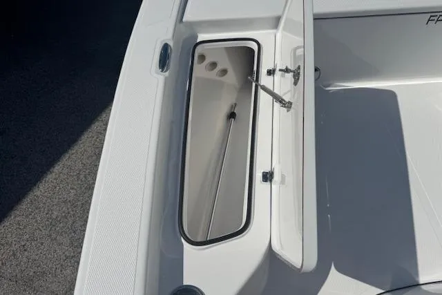 Slide: The Image of Open storage compartment on 2026 Frontier 2104 boat deck. - 18