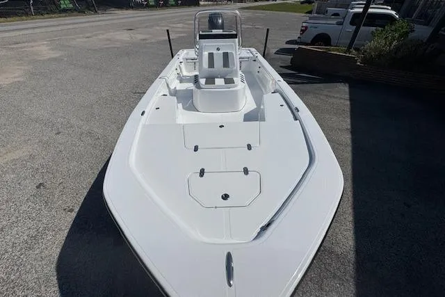 Slide: The Image of Frontier 2104 boat, 2026 model, sleek white design, parked on pavement. - 8