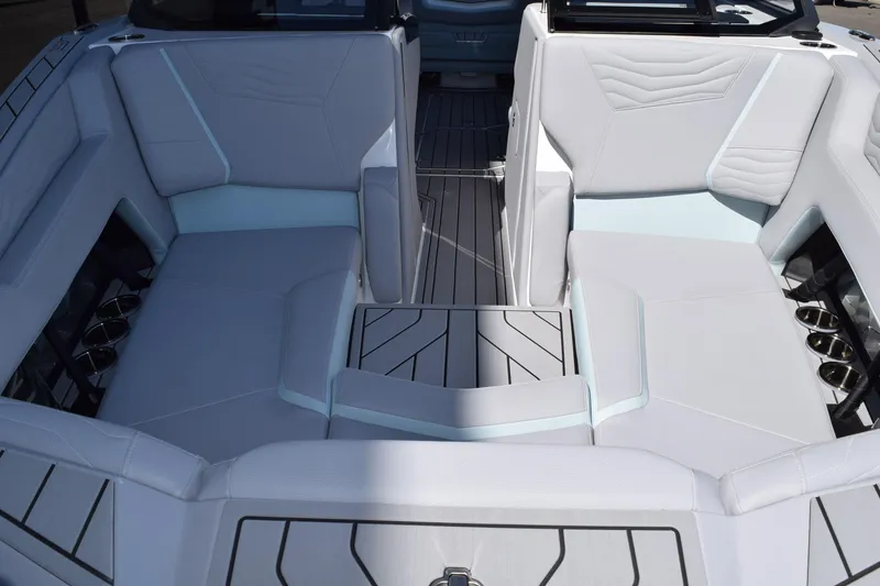 Slide: The Image of 2025 Nautique Super Air Nautique G23 Paragon interior with luxurious seating and modern design. - 13