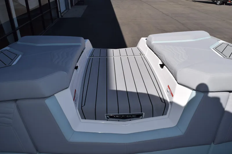 Slide: The Image of 2025 Nautique Super Air Nautique G23 Paragon boat interior with sleek gray seating. - 16