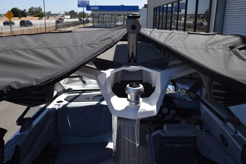 Slide: The Image of 2025 Nautique Super Air Nautique G23 Paragon interior with canopy, showcasing luxury boat features. - 19