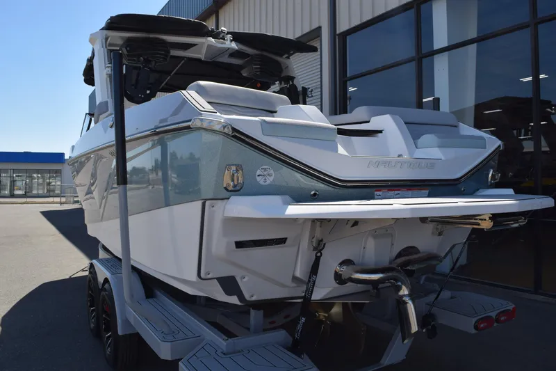 Slide: The Image of 2025 Nautique Super Air Nautique G23 Paragon boat on trailer, rear view. - 3