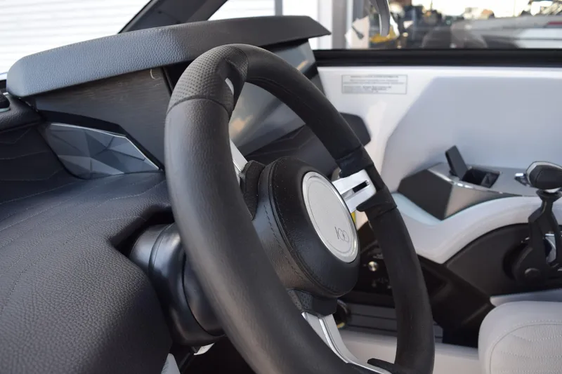 Slide: The Image of 2025 Nautique Super Air Nautique G23 Paragon steering wheel and dashboard interior. - 8