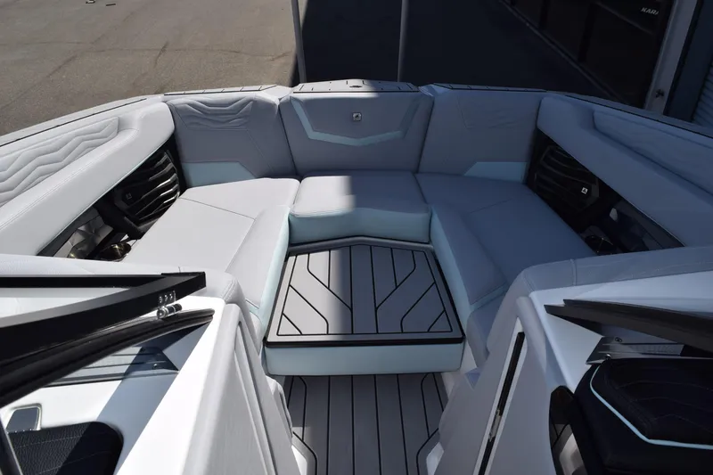 Slide: The Image of 2025 Nautique Super Air Nautique G23 Paragon interior with luxurious seating and sleek design. - 12