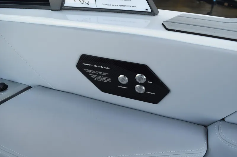Slide: The Image of 2025 Nautique Super Air Nautique G23 Paragon tower controls on white interior panel. - 14