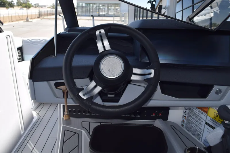 Slide: The Image of 2025 Nautique Super Air Nautique G23 Paragon steering wheel and dashboard interior. - 6