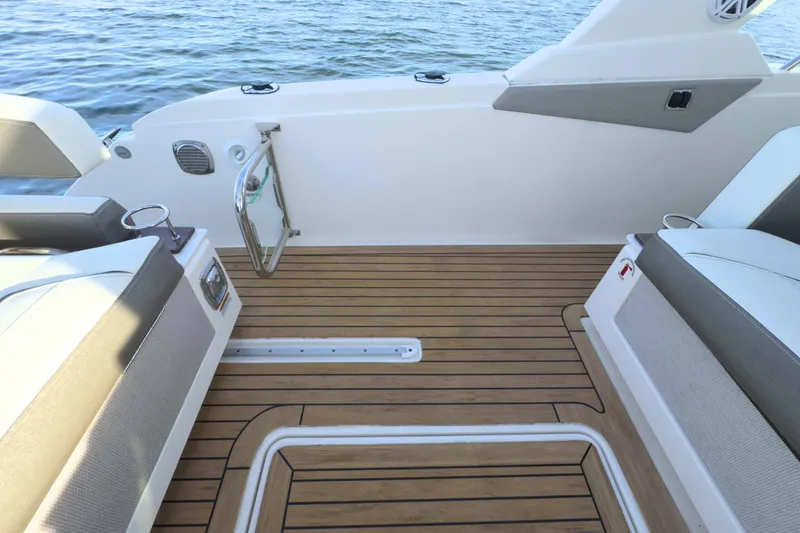 Slide: The Image of 2022 Tiara Yachts 34 LS deck with sleek seating and wood finish. - 14