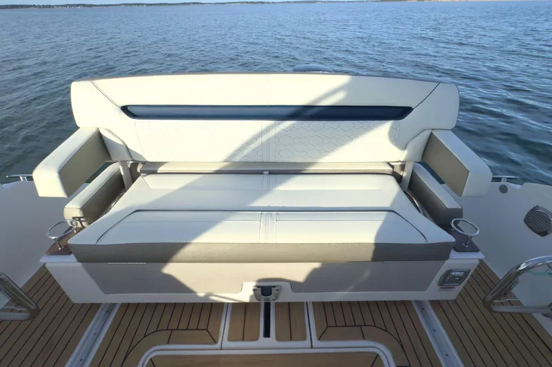 Slide: The Image of 2022 Tiara Yachts 34 LS boat with luxurious seating on open water. - 16