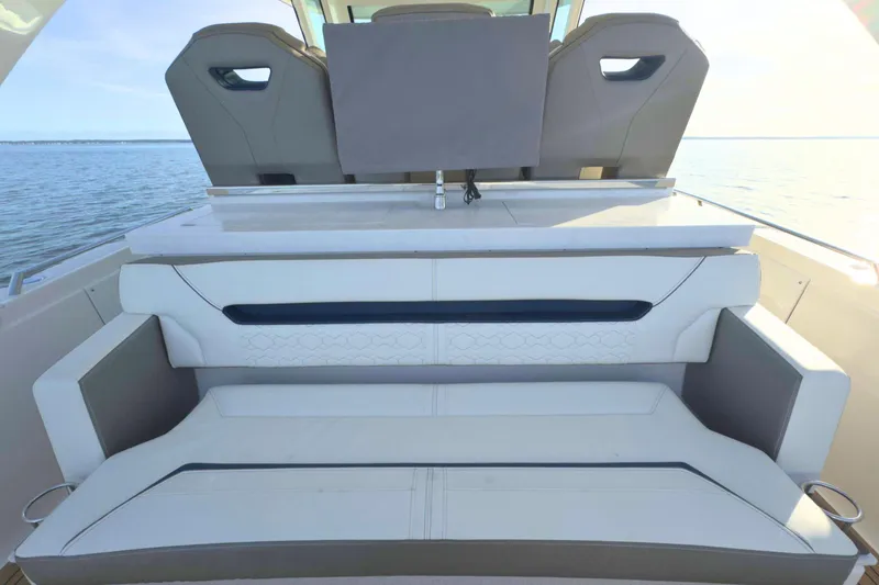 Slide: The Image of 2022 Tiara Yachts 34 LS luxury seating area with ocean view. - 17