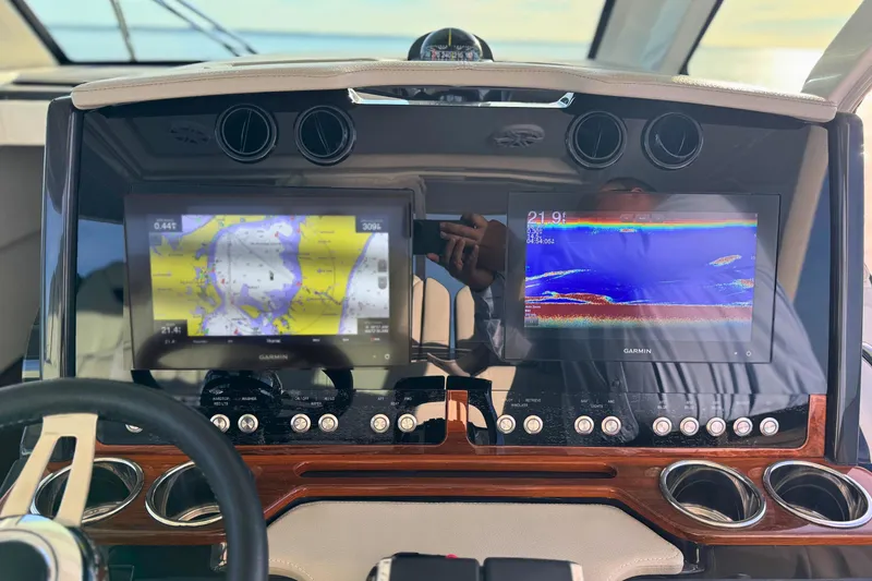 Slide: The Image of Dashboard of 2022 Tiara Yachts 34 LS with Garmin navigation displays. - 28