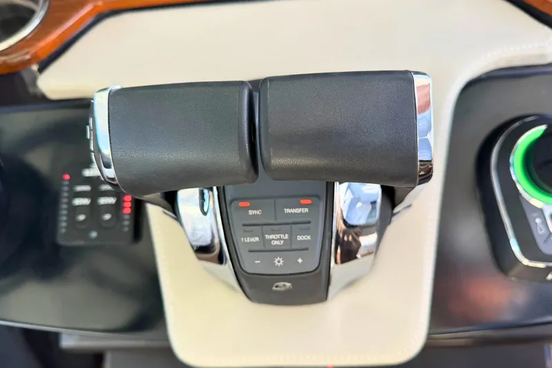 Slide: The Image of Throttle controls of a 2022 Tiara Yachts 34 LS, featuring modern design and functionality. - 30