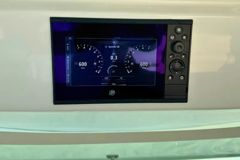 Slide: The Image of Dashboard display of 2022 Tiara Yachts 34 LS showing system status and RPM. - 34