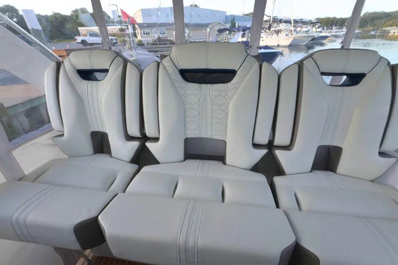 Slide: The Image of Luxurious seating on 2022 Tiara Yachts 34 LS, featuring elegant white upholstery and modern design. - 37