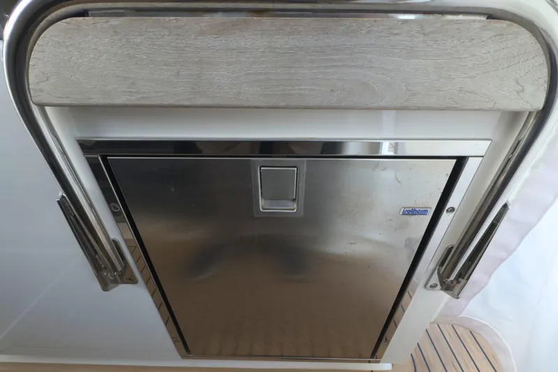 Slide: The Image of Stainless steel refrigerator on 2022 Tiara Yachts 34 LS boat. - 38