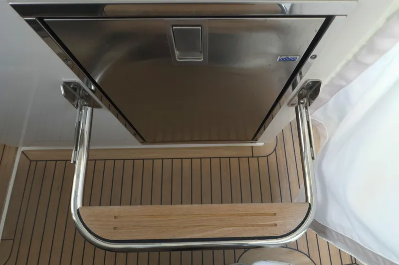 Slide: The Image of Stainless steel hatch and wooden step on 2022 Tiara Yachts 34 LS. - 39