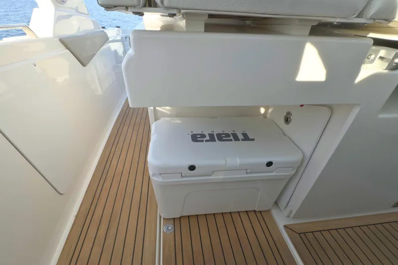 Slide: The Image of 2022 Tiara Yachts 34 LS interior with teak flooring and branded cooler. - 41