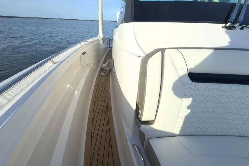 Slide: The Image of 2022 Tiara Yachts 34 LS boat deck with elegant seating and ocean view. - 44