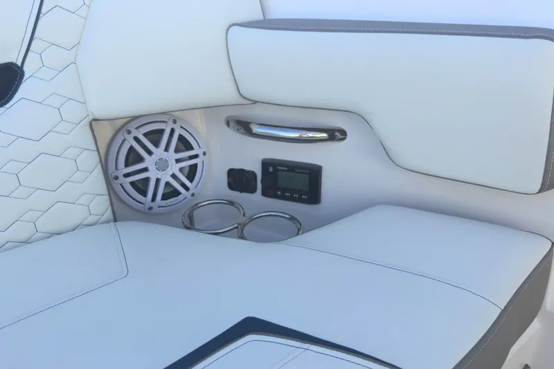 Slide: The Image of Luxury seating area on 2022 Tiara Yachts 34 LS with speaker and cup holders. - 47