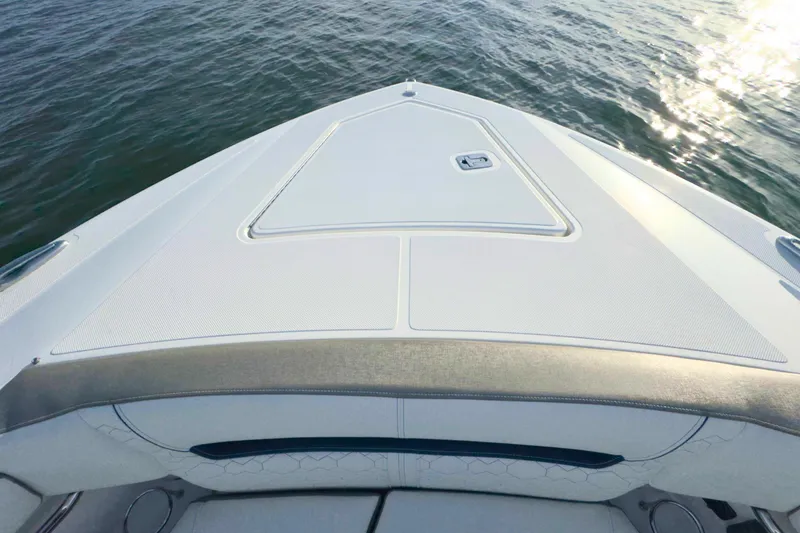 Slide: The Image of 2022 Tiara Yachts 34 LS bow view on calm water, showcasing sleek design. - 48