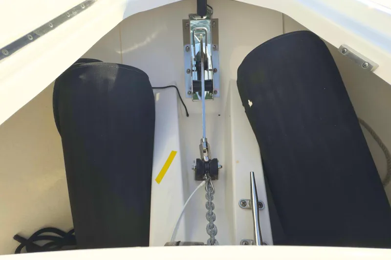 Slide: The Image of Anchor compartment of 2022 Tiara Yachts 34 LS with chain and fender storage. - 49