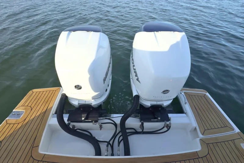 Slide: The Image of 2022 Tiara Yachts 34 LS with dual Mercury outboard engines on water. - 52